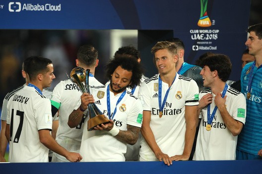 Marcelo of Real Madrid celebrates with the FIFA Club World Cup trophy at the end of the FIFA Club World Cup UAE final match between Real Madrid and Al Ain at Sheikh Zayed Stadium on December 22, 2018 in Abu Dhabi, United Arab Emirates