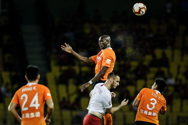 Mbia # 25 of Wuhan Zall and Arnautovic # 7 of Shanghai SIPG in action during 2019 China Super League at Wuhan Wuhuan Sports Center on July 28, 2019 in Wuhan China. 